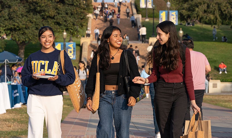 Three UCLA students at Wilson Plaza